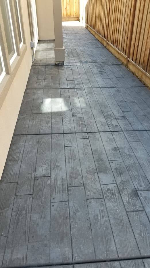 New textured concrete residential home patio deck