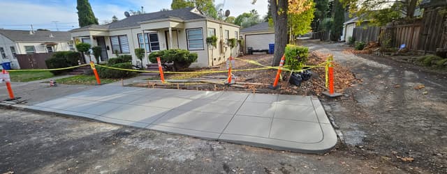 New concrete public sidewalk with concrete curbs 